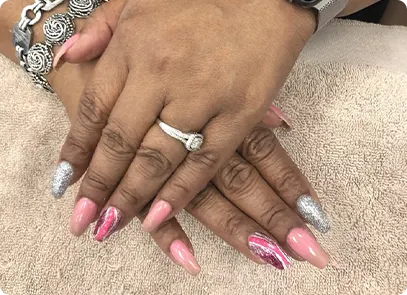 brown hand pink silver nail polish